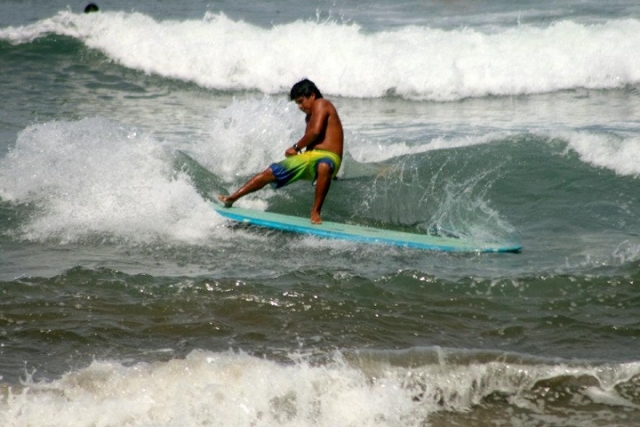 Paddte surf con olas